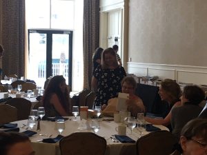 Kelley Armstrong, Melissa Marr and I presenting Charlaine Harris with a vampire merman gift at the Crescent City Brunch.